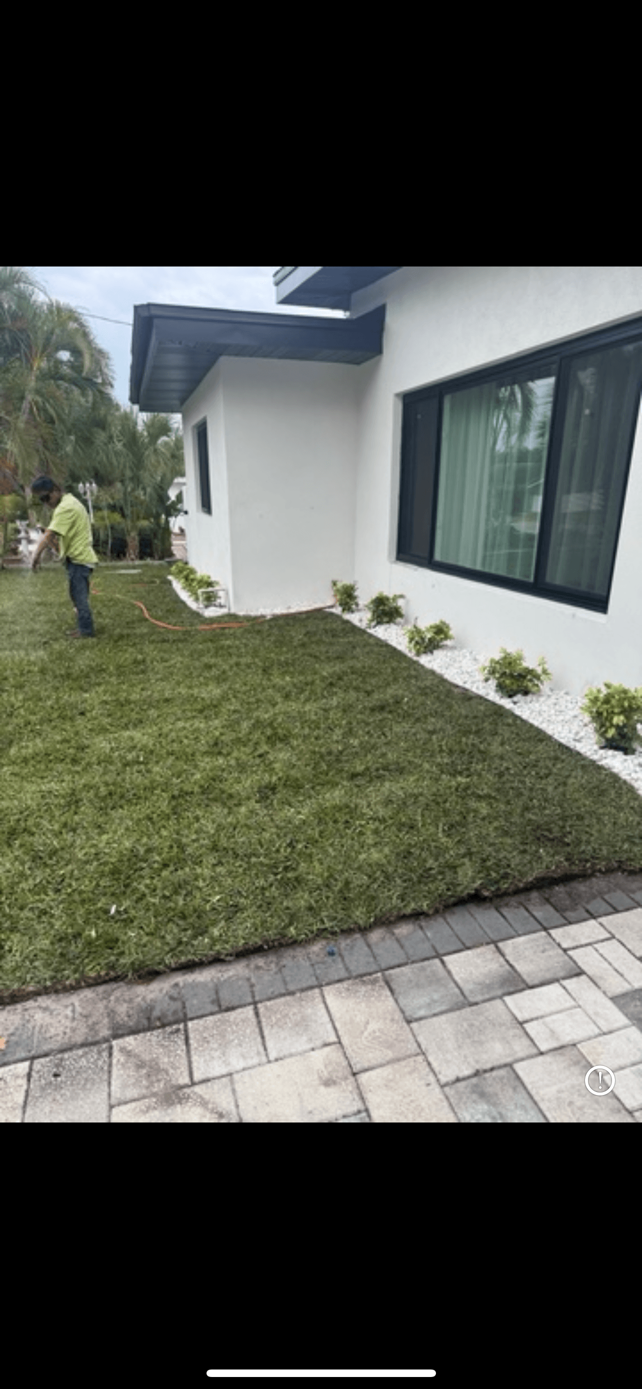 General Sod Tampa team member installing sod on-site